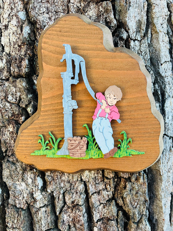 Old Water Hand Pump with Boy Scroll Art
