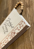 Wood, beaded tabletop book
